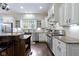 Well-lit kitchen featuring stainless steel appliances, granite countertops, and custom cabinets at 11393 Muirfield Trce, Fishers, IN 46037