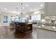 Well-lit kitchen with a large island, seating, and modern stainless steel appliances at 11393 Muirfield Trce, Fishers, IN 46037