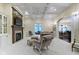 Bright living room featuring coffered ceilings, a fireplace, and stylish seating arrangements at 11393 Muirfield Trce, Fishers, IN 46037
