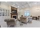 Bright living room featuring coffered ceilings, a fireplace, and stylish seating arrangements at 11393 Muirfield Trce, Fishers, IN 46037
