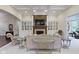 Bright living room featuring coffered ceilings, a fireplace, and stylish seating arrangements at 11393 Muirfield Trce, Fishers, IN 46037