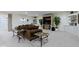 Living room with neutral walls and carpet with built-in shelving at 11393 Muirfield Trce, Fishers, IN 46037