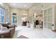 Spacious living room featuring a seamless flow to the dining area and kitchen at 11393 Muirfield Trce, Fishers, IN 46037