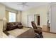 Comfortable home office featuring a leather chair, wood floors, and bright natural light at 11393 Muirfield Trce, Fishers, IN 46037