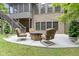 Outdoor patio features a stone fire pit surrounded by comfortable seating at 11393 Muirfield Trce, Fishers, IN 46037