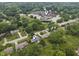 Aerial view of home and Woodbrook Elementary School in the surrounding neighborhood at 11409 Haverstick Rd, Carmel, IN 46033