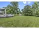 Expansive backyard featuring a well-maintained lawn and deck at 11409 Haverstick Rd, Carmel, IN 46033