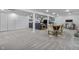 Finished basement featuring a cozy seating area, dining table, and neutral carpeting at 11409 Haverstick Rd, Carmel, IN 46033