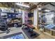 Basement area with exercise equipment, shelving, and exposed ceilings at 11409 Haverstick Rd, Carmel, IN 46033