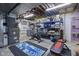 Unfinished basement area with exercise equipment, shelving, and exposed ceilings at 11409 Haverstick Rd, Carmel, IN 46033