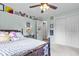 Bright bedroom offers ample space and storage featuring a soft bed and plenty of room at 11409 Haverstick Rd, Carmel, IN 46033