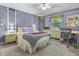 Charming bedroom featuring tree-themed decor, a comfy bed, and a functional work desk at 11409 Haverstick Rd, Carmel, IN 46033