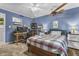 Comfortable bedroom featuring natural light, and complemented by a functional desk area at 11409 Haverstick Rd, Carmel, IN 46033