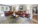 Cozy living room with comfortable seating, a coffee table, and a stylish rug at 11409 Haverstick Rd, Carmel, IN 46033