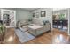 Comfortable living area featuring hardwood floors, a plush sectional sofa and stylish decor at 11409 Haverstick Rd, Carmel, IN 46033