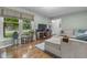 Bright living room boasting hardwood floors, a large window, and comfortable seating at 11409 Haverstick Rd, Carmel, IN 46033