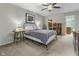 Comfortable bedroom featuring neutral tones, ceiling fan, and ample natural light, a calming retreat at 11409 Haverstick Rd, Carmel, IN 46033