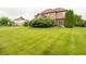 Expansive backyard featuring lush green grass, mature trees, and well-maintained landscaping at 1145 Forest Commons Dr, Avon, IN 46123
