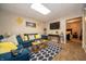 Finished basement area with a plush couch, TV and a view of the basement bedroom at 1145 Forest Commons Dr, Avon, IN 46123