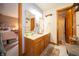 Shared bathroom space with double sinks, bright lighting, and wood-trimmed accents at 1145 Forest Commons Dr, Avon, IN 46123