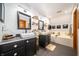 Bright bathroom featuring double vanities, vessel sinks, and soaking tub with decorative accents at 1145 Forest Commons Dr, Avon, IN 46123