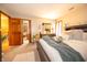 Bedroom with a neutral color palette, plush bedding, ample sunlight, and open doorways at 1145 Forest Commons Dr, Avon, IN 46123