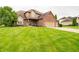 Charming two-story home with a brick and siding exterior, lush green lawn, and a welcoming front porch at 1145 Forest Commons Dr, Avon, IN 46123