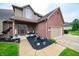 Welcoming front entrance featuring a decorative door, potted plants, and a well-maintained walkway at 1145 Forest Commons Dr, Avon, IN 46123