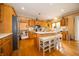 Spacious kitchen featuring an island with seating, stainless steel appliances, and ample counter space at 1145 Forest Commons Dr, Avon, IN 46123