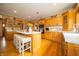 Bright kitchen features wood cabinets, a center island with seating, and stainless steel appliances at 1145 Forest Commons Dr, Avon, IN 46123