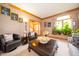 Comfortable living room featuring cozy seating, tasteful decor, and a large window with plants at 1145 Forest Commons Dr, Avon, IN 46123