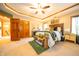 Large main bedroom featuring a king-size bed, tray ceilings, and ample storage at 1145 Forest Commons Dr, Avon, IN 46123