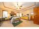 Spacious main bedroom with a tray ceiling, decorative lighting, and ample natural light at 1145 Forest Commons Dr, Avon, IN 46123