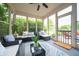 Inviting sunroom with comfortable seating, large windows offering abundant natural light, and a ceiling fan at 1145 Forest Commons Dr, Avon, IN 46123