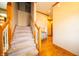 Elegant staircase with wooden railings and carpeted steps, leading to the upper level of the home at 1145 Forest Commons Dr, Avon, IN 46123