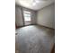 Cozy bedroom with neutral-colored carpeting and natural light from the window at 1201 Briarwood Dr, Brownsburg, IN 46112