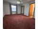 Spacious bedroom features a ceiling fan, neutral walls, and large window at 1201 Briarwood Dr, Brownsburg, IN 46112