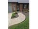 Charming front entrance features a brick walkway, tidy landscaping, and a welcoming front door at 1201 Briarwood Dr, Brownsburg, IN 46112