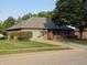 Attractive single-story brick house with a well-kept lawn and attached garage in a quiet neighborhood at 1201 Briarwood Dr, Brownsburg, IN 46112