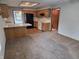 Well-lit kitchen featuring oak cabinets, modern white appliances, and black refrigerator at 1201 Briarwood Dr, Brownsburg, IN 46112