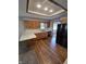 Efficient kitchen with oak cabinets, modern black appliances, and a breakfast bar at 1201 Briarwood Dr, Brownsburg, IN 46112