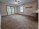 Cozy sunroom with sliding glass doors and a ceiling fan at 1201 Briarwood Dr, Brownsburg, IN 46112