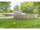 Fenced backyard with well-manicured lawn, backing up to the home's garage and driveway at 12014 Briar Way Center Dr, Indianapolis, IN 46126
