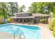 Spacious backyard featuring a refreshing in-ground pool and patio, perfect for outdoor entertainment and relaxation at 12014 Briar Way Center Dr, Indianapolis, IN 46126