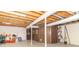 Unfinished basement space with wooden beams, concrete floor, and storage solutions at 12014 Briar Way Center Dr, Indianapolis, IN 46126