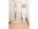Neat bathroom featuring a glass shower enclosure, toilet, and neutral-toned floor tiles at 12014 Briar Way Center Dr, Indianapolis, IN 46126