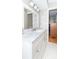 Stylish bathroom with a marble vanity, white cabinets, and hexagonal tile flooring at 12014 Briar Way Center Dr, Indianapolis, IN 46126