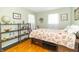 Comfortable bedroom featuring built-in storage and wood floors at 12014 Briar Way Center Dr, Indianapolis, IN 46126