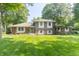 Beautifully landscaped lawn and colorful planters complement this brick and siding two-story home at 12014 Briar Way Center Dr, Indianapolis, IN 46126