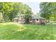 Charming brick and siding home with mature trees and a well-maintained lawn at 12014 Briar Way Center Dr, Indianapolis, IN 46126